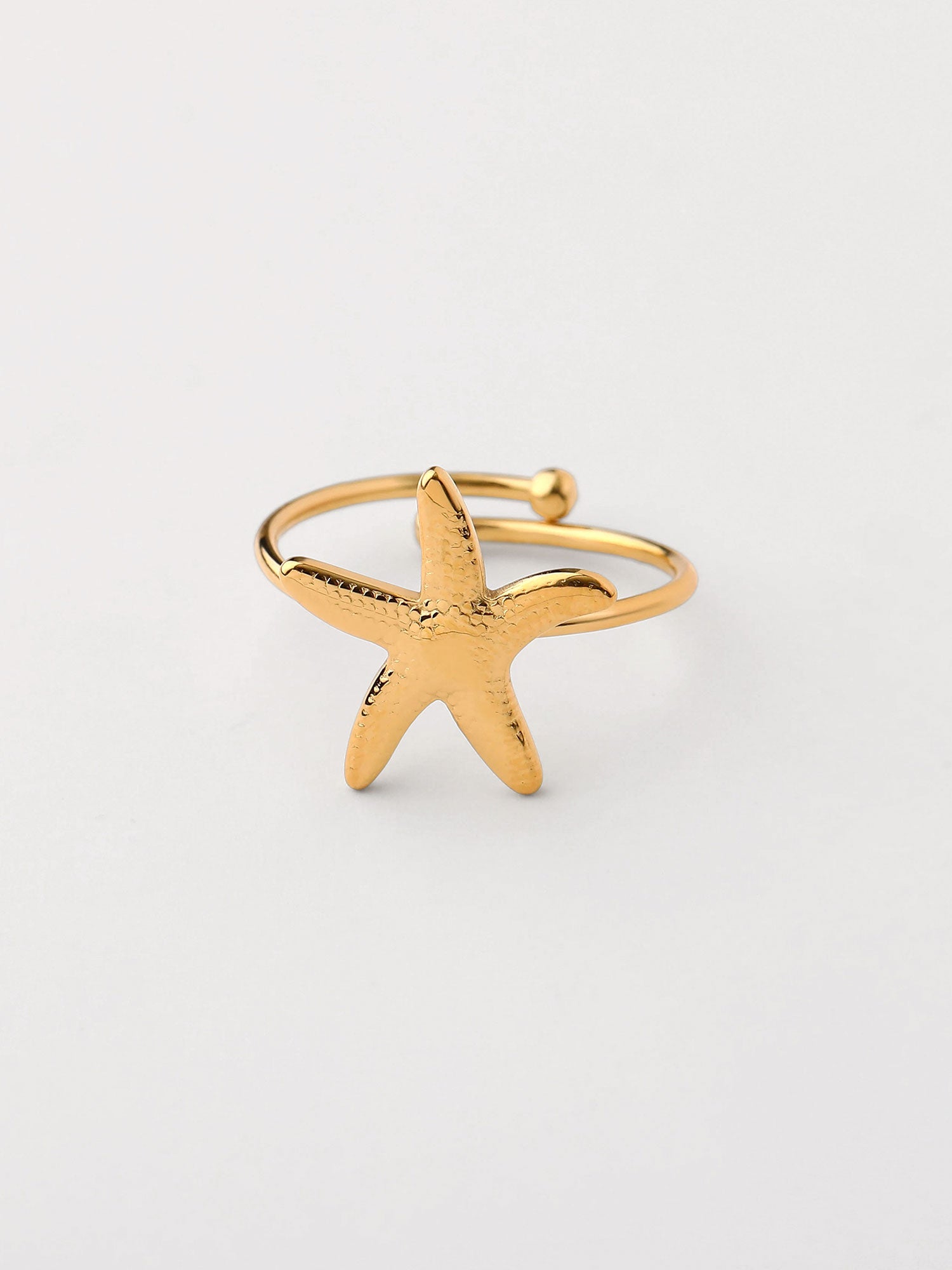 Anel com forma de estrella de mar Dourado