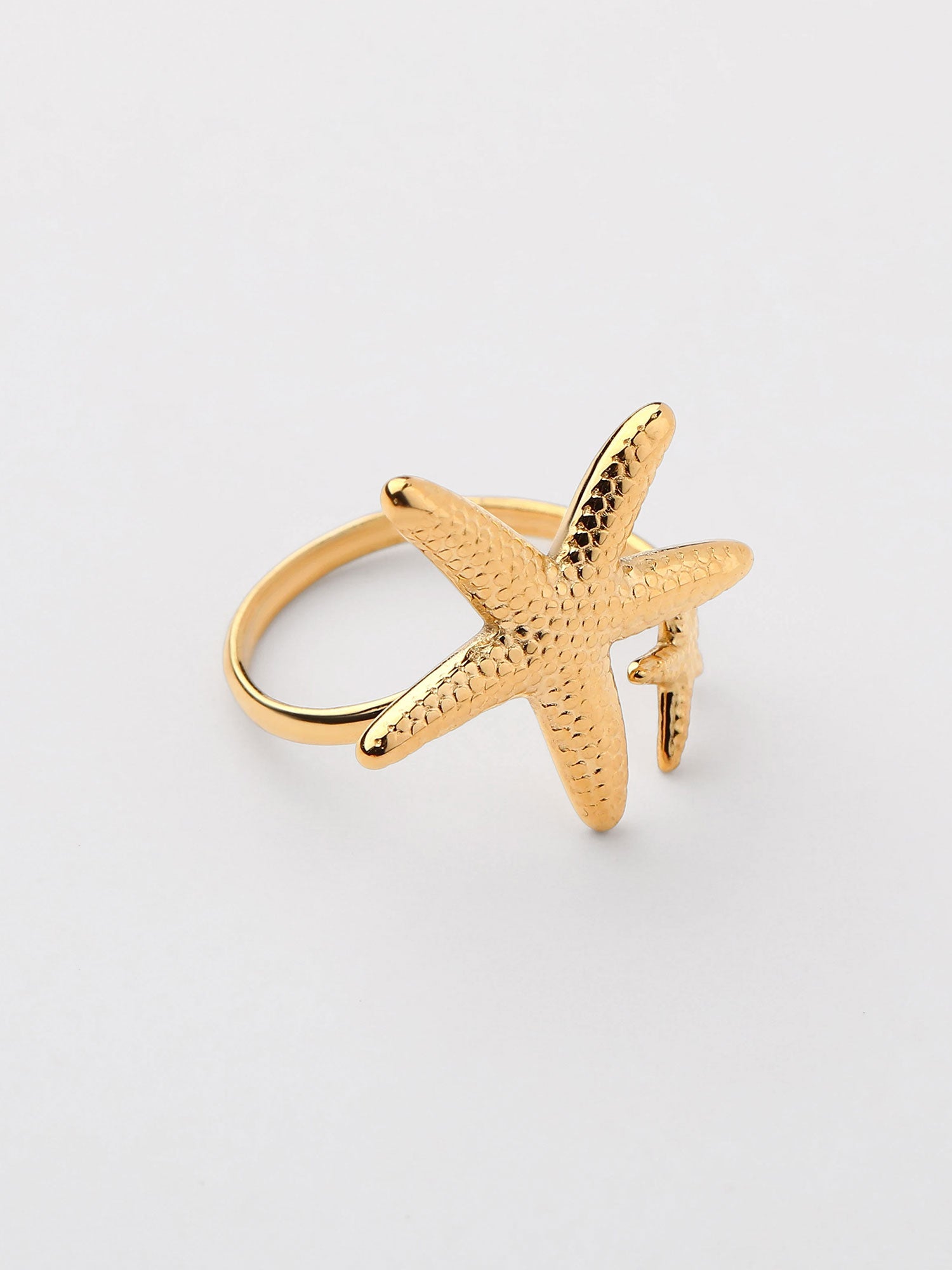 Anel forma estrellas de mar Dourado