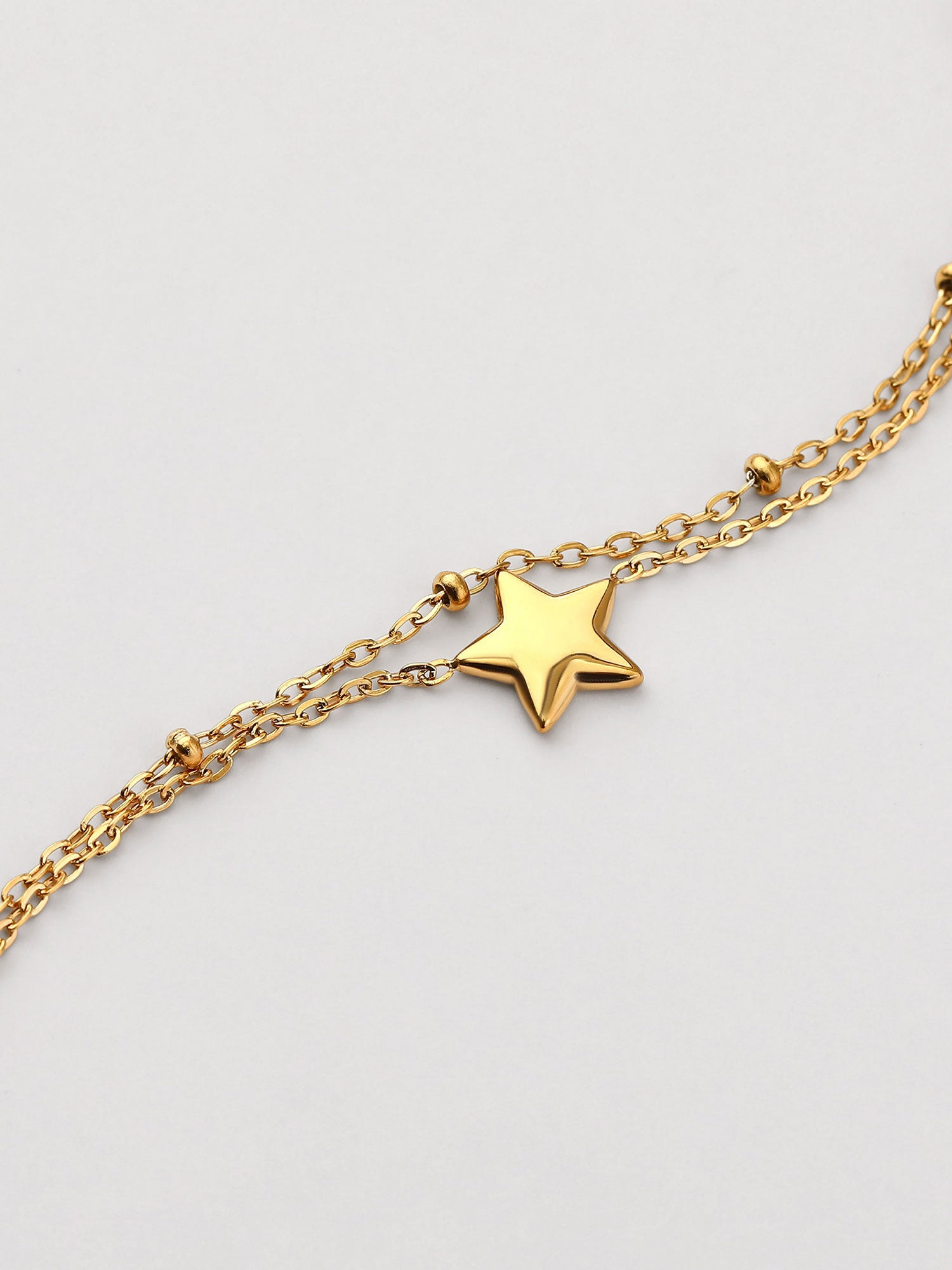 Pulseira simples com figura estrella dorada