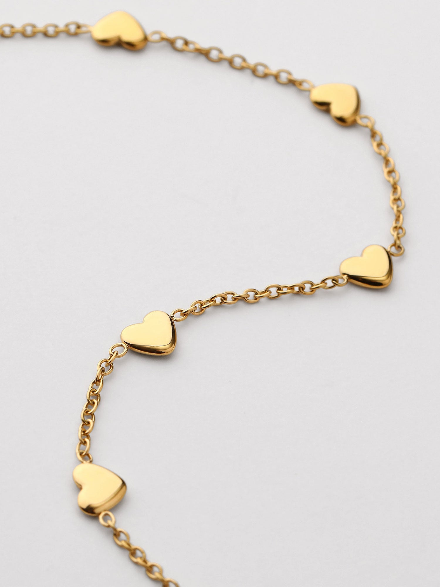 Pulseira de corazones dorada