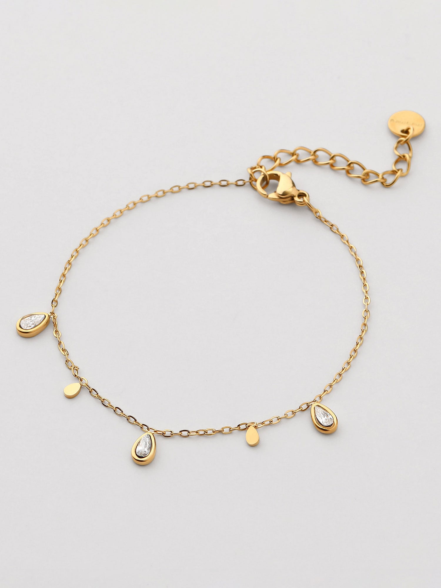 Pulseira fina com zircónias branca dorada