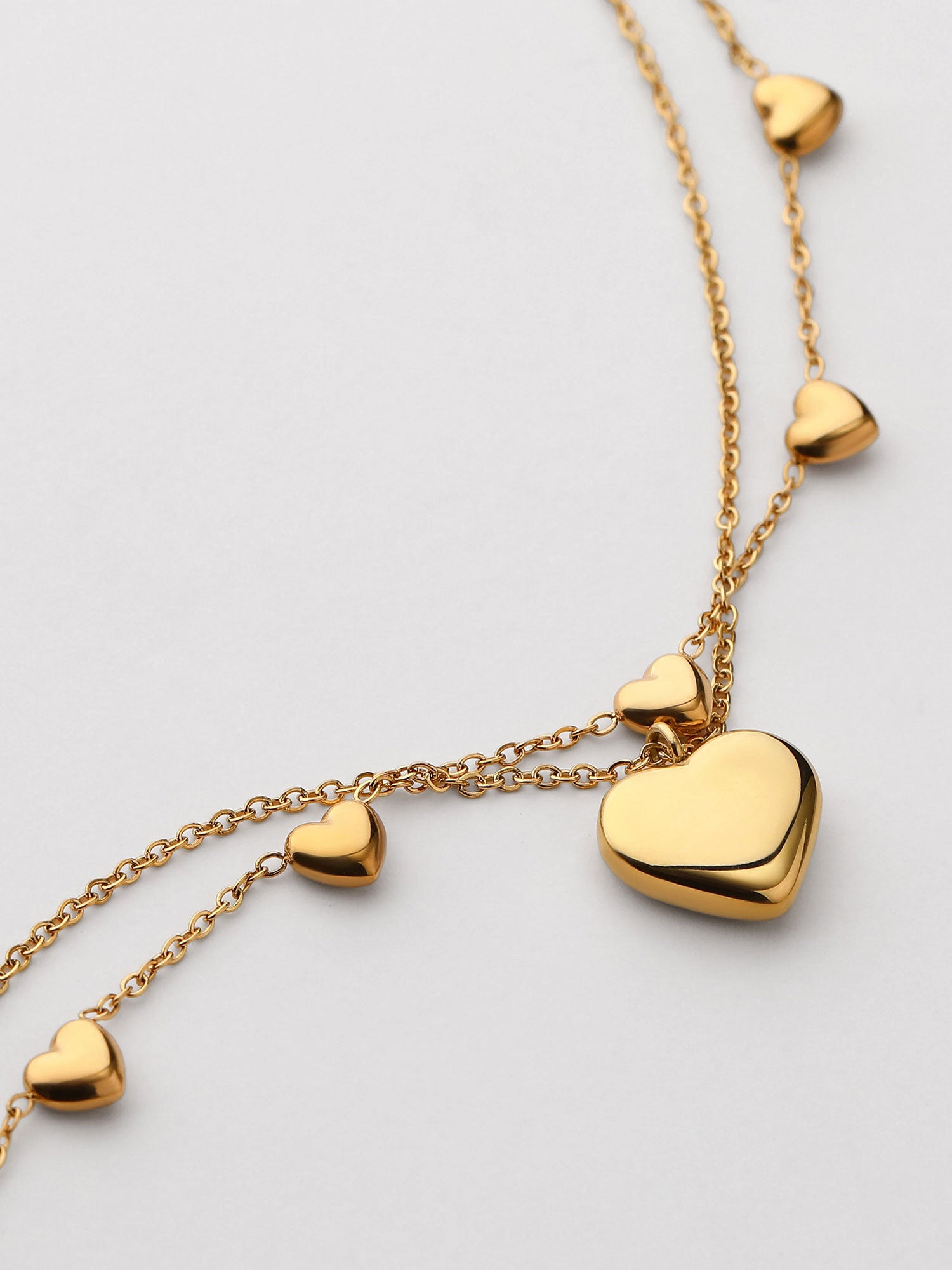 Pulseira duplo com corazones dorada