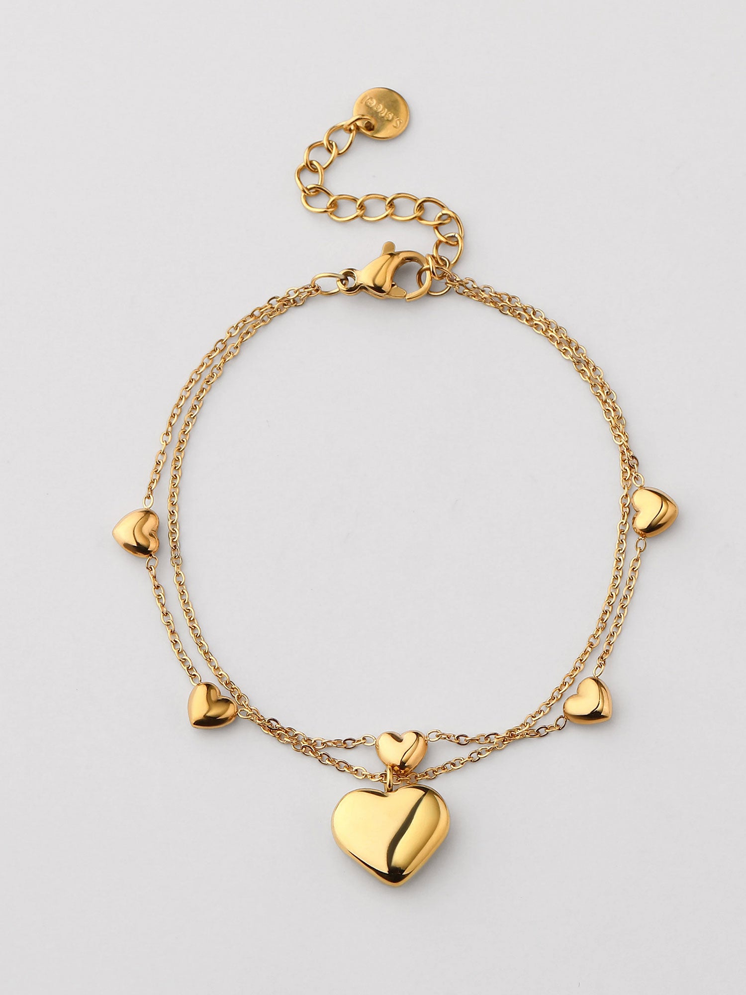 Pulseira duplo com corazones dorada
