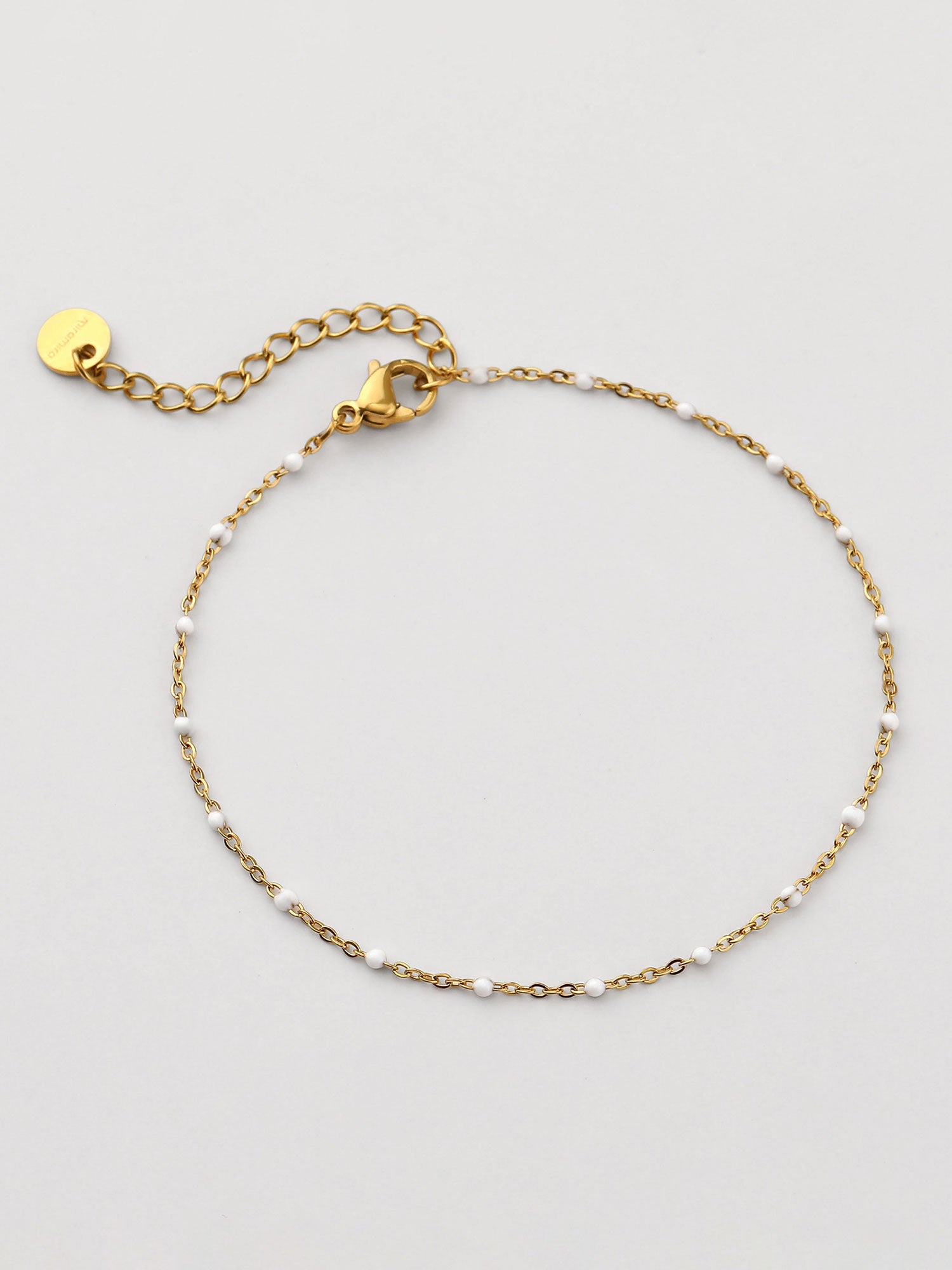 Pulseira com piedra natural branca dorada