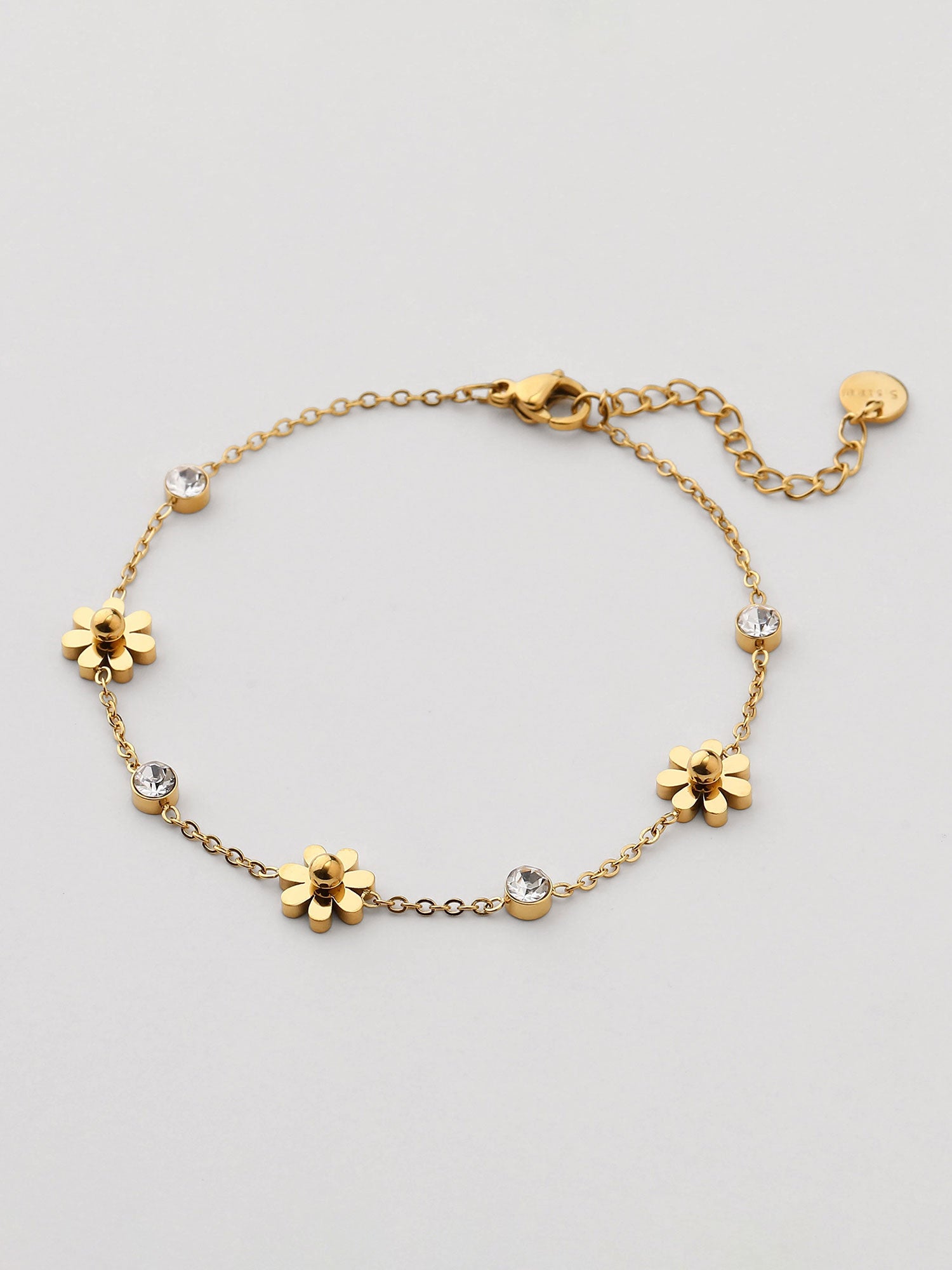 Pulseira de flores com zircónias dorada