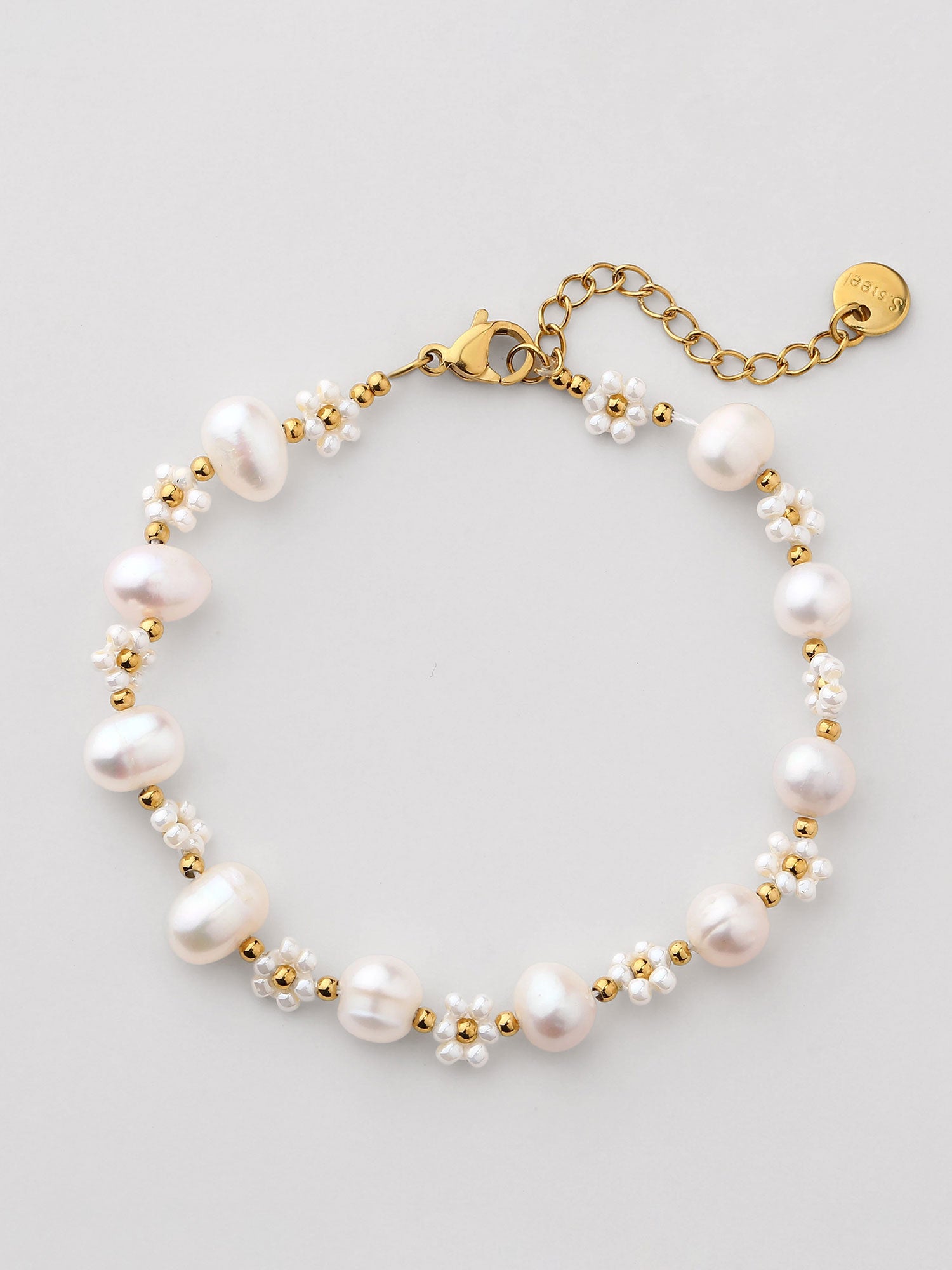 Pulseira de perla dorada