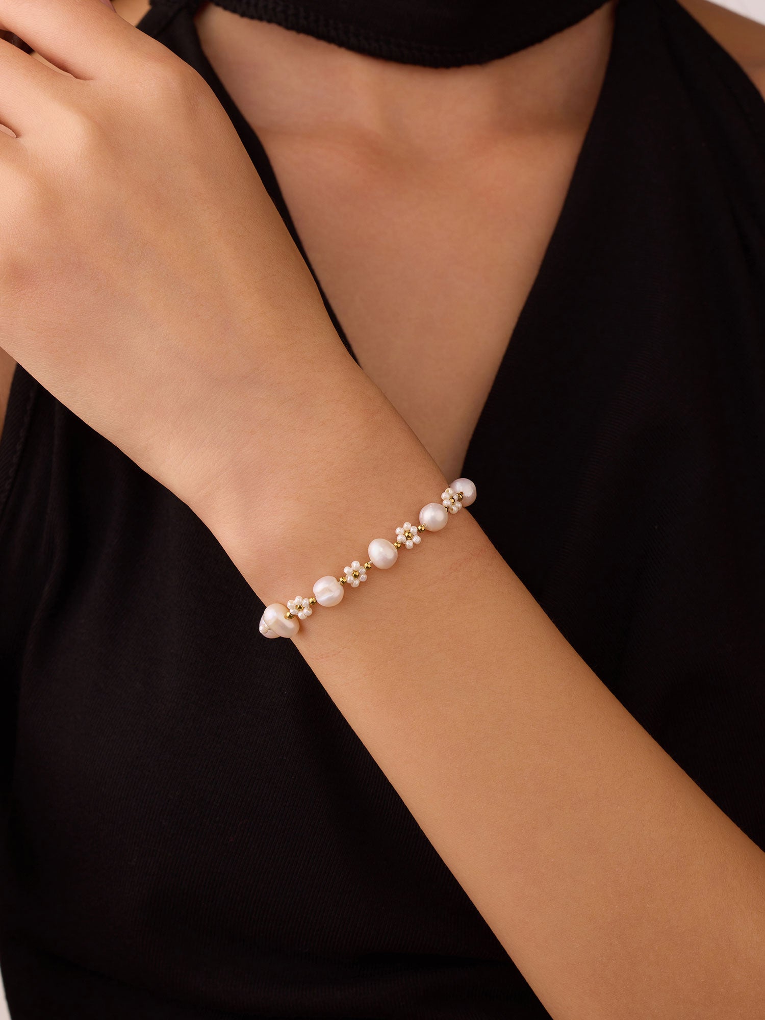 Pulseira de perla dorada