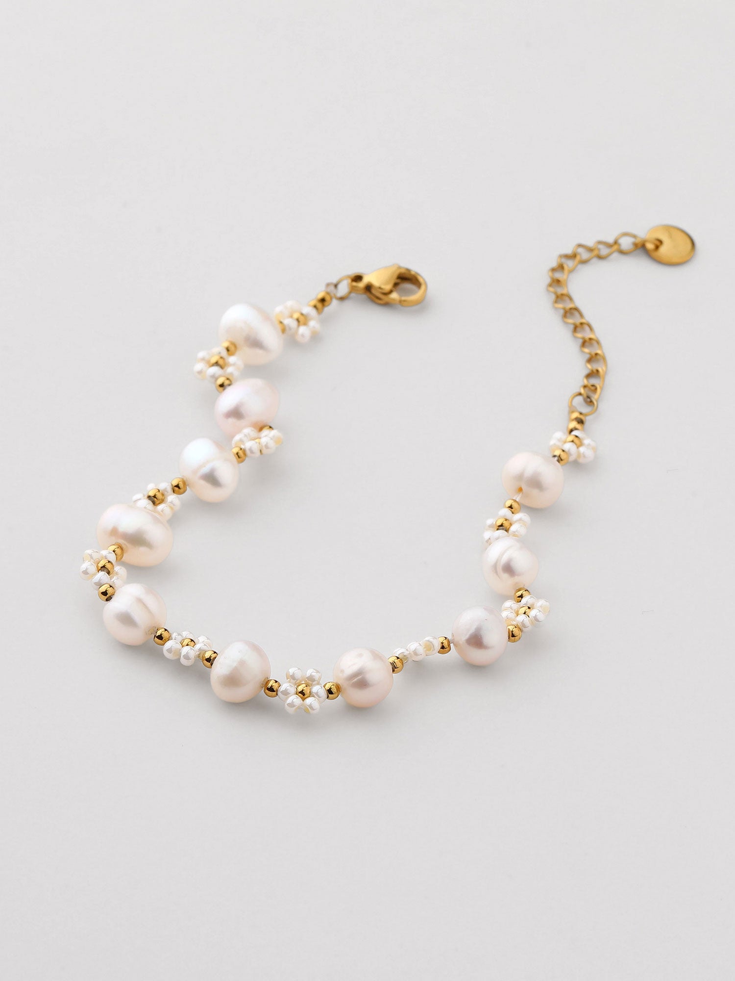 Pulseira de perla dorada