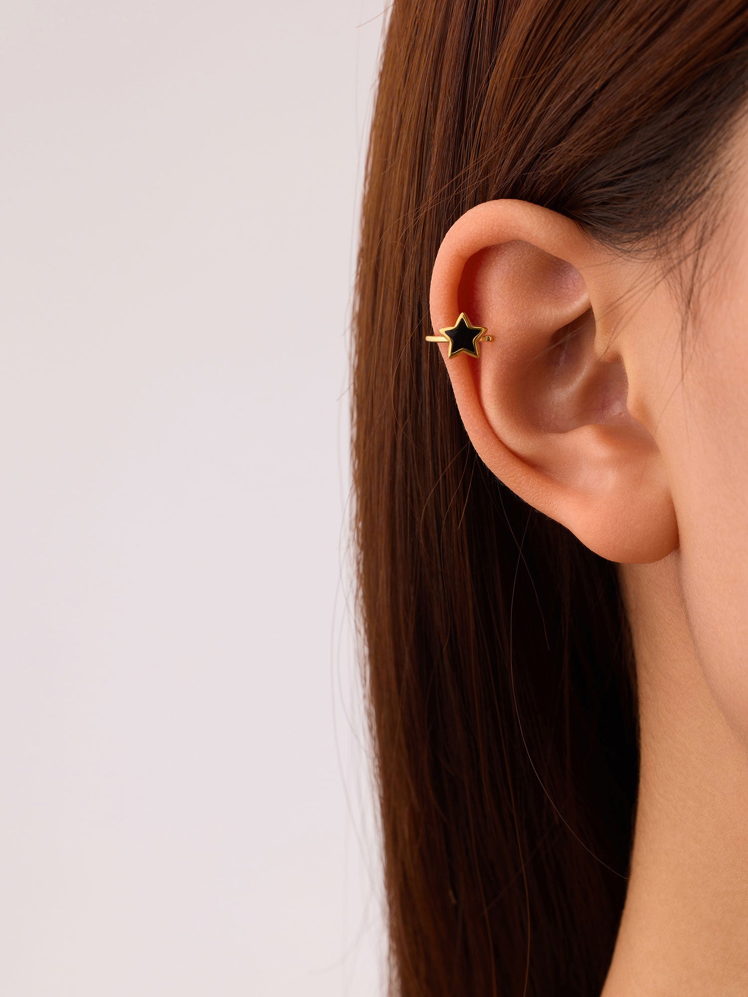 Ear cuff Yana estrela com zircónias pretas dourado
