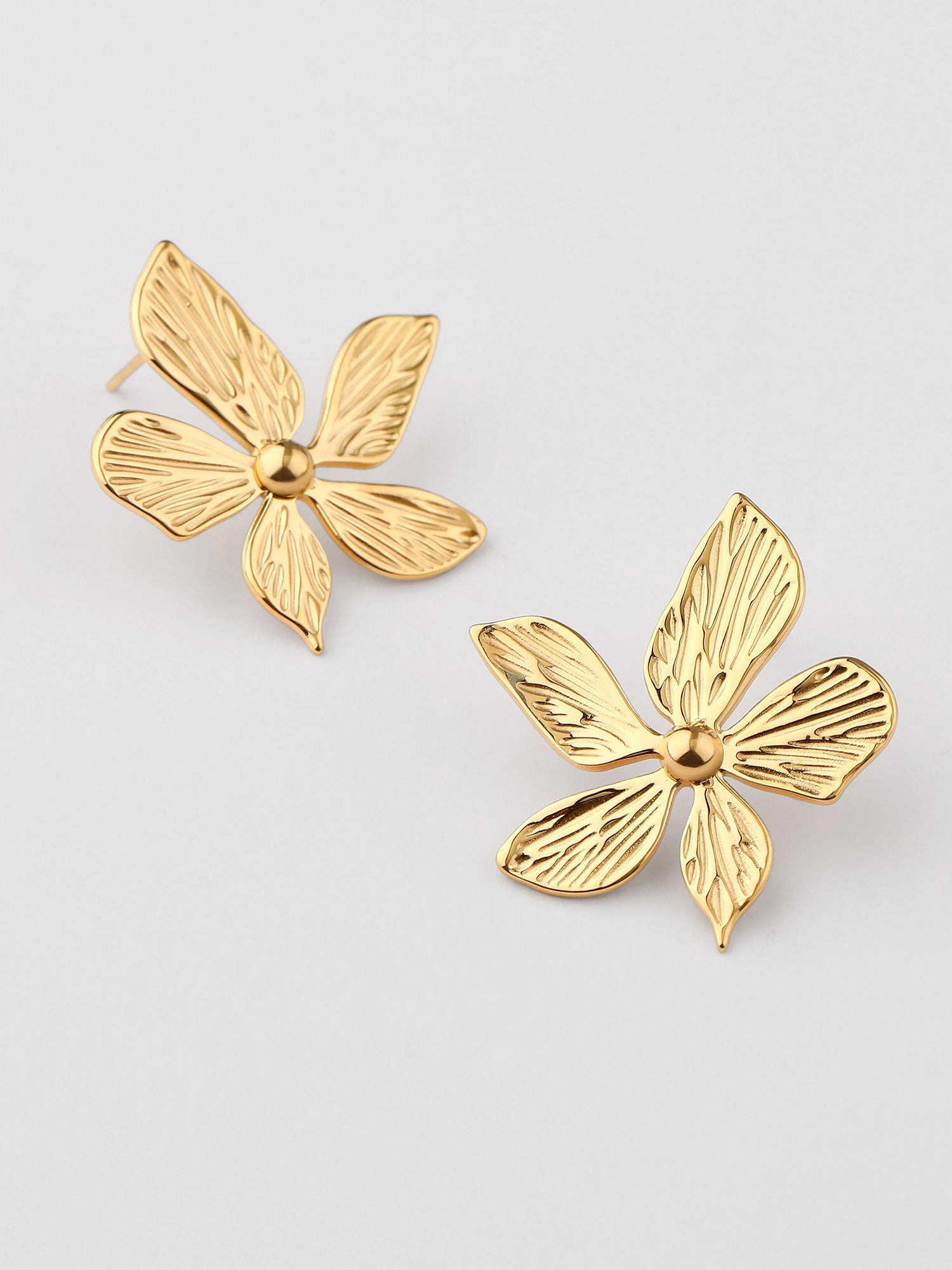Brincos Elora flor dourados