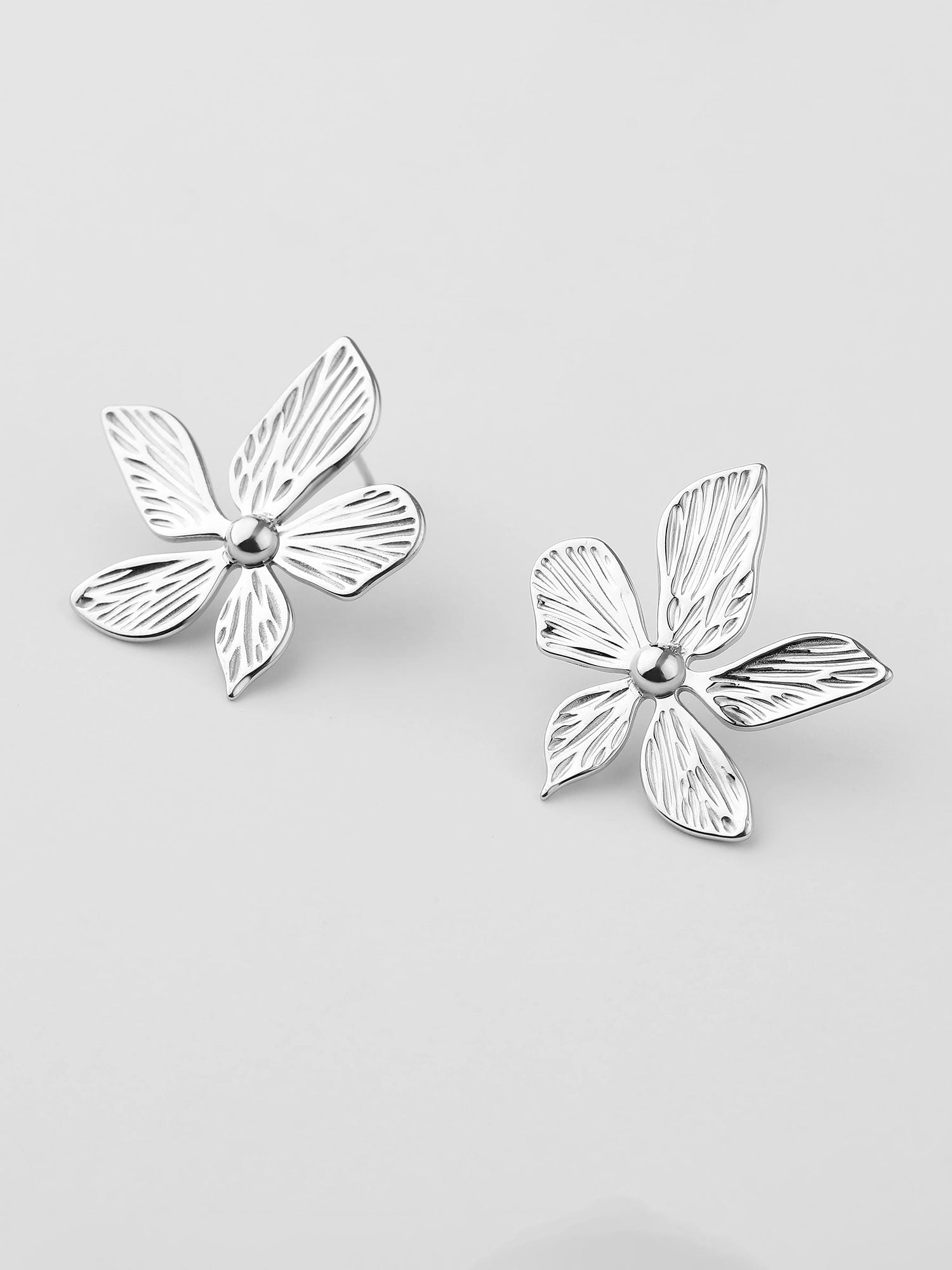 Brincos Elora flor prateados