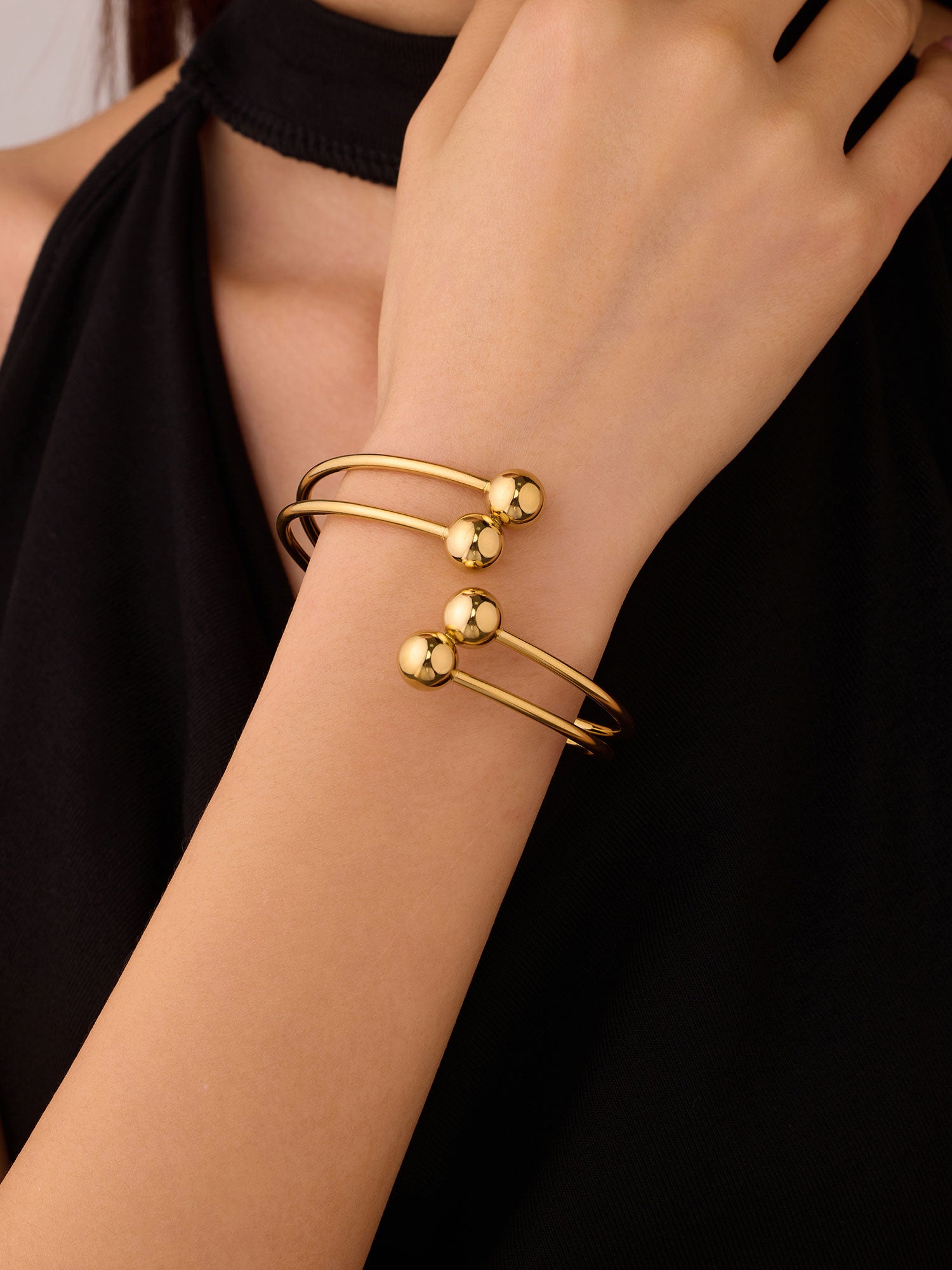 Bracelete duplo fino com bolitas Dourado